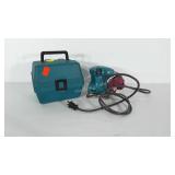 Makita hand electric sander with case. Works.