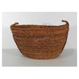 Large woven basket with rope handles. Measures