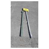 No parking sign and two metal fence post