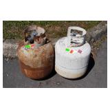 Two filled propane grill tanks, one fills full,