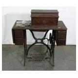 Early sewing table with Singer machine, age wear