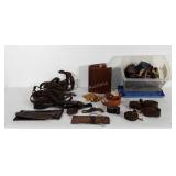 Box of leatherworking scraps and belts, includes