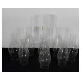 Group of glass oil lamp chimneys, sizes range