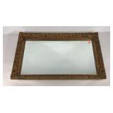 Ornate wood and plaster gilt framed mirror,