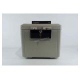 Sentry 1170 safe with key.  The top piece needs