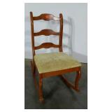 Ladderback bedroom rocker with upholstered seat.