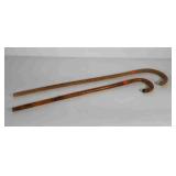 Two canes, one wood, one bamboo, from the estate