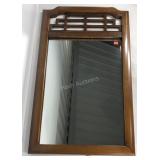 Wall mirror with lattice top and carved details,
