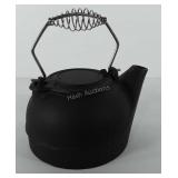 Cast iron tea kettle with metal handle