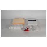 Office supplies, folders, paper clips, tape, and