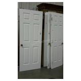 Four interior six panel doors.  All with hinges,