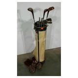 Golf clubs and drivers in an old golf bag, Wilson