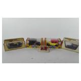 Five model cars in original packaging, includes