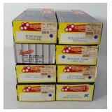 Eight round house box cars, in original boxes