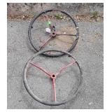 Two tractor steering wheels