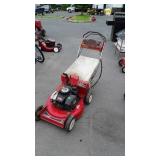 Older two cycle Toro push mower, with bagger will