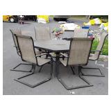 Glass top patio table and six chairs table is 50