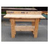 Wooden work bench, is 5 feet long and 41" tall