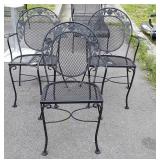 Three wrought iron patio chairs