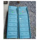 Two blue metal car ramps