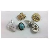 Five brooches