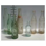 7 soda bottles, Pepsi-Cola, Coca-Cola, Harpers