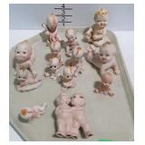 Porcelain Kewpie doll / piano baby figurines