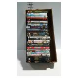 Flat of movie DVDs Zoolander, mixed nuts, Shrek,