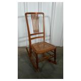Nice older cane bottom rocker. Turned spindles.