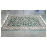 Green area rug with flower motif, 68"x96"
