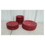 Red dinner ware. Eight dinner plates, seven