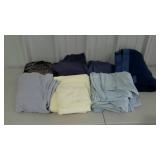 Assorted sheets in blues and yellow and two blue