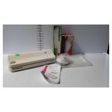 Food Saver Compact II with booklet, bags, and jar