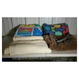 Two comforters, one thermal blanket and a