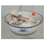 Enamel bowl full of shells and coral.