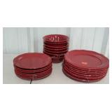 Red dinner ware. Eight dinner plates, seven