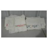 Embroidered bed linens. Two top sheets and five
