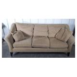 Gold colored living room sofa, made by Maurice