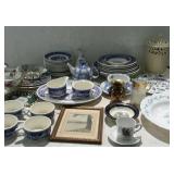 Group of blue and white cups, bowls, cream and