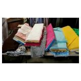 Rolls of fabric for clothing, plus pillow  some