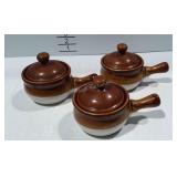 Trio of handled bowls with lids