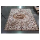 Leaf design area rug, does show discoloration in