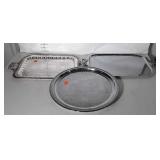 Three serving trays, one is silver over copper