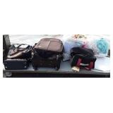 Skid with suitcases, clothes, pocketbooks,