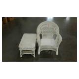 Wicker patio chair with small table.