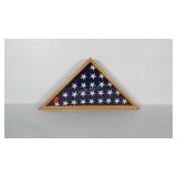 American flag in wood and glass display case.