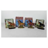 Four stallion figures with boxes, includes two