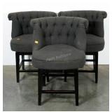 Three upholstered,  swivel bar stools. Button