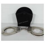 Handcuffs with side kick belt loop cuff holder,