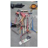 Big Group of Long Handled Tools, rakes, saws,